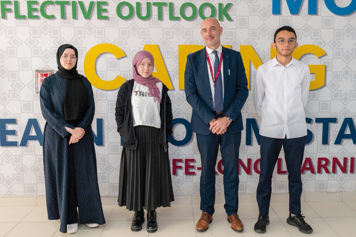 Abdelrahman Moustafa (right), Nour Houssam Baba and Sarah Bouhssine with DA schools Principal Edward Cooper (second right).