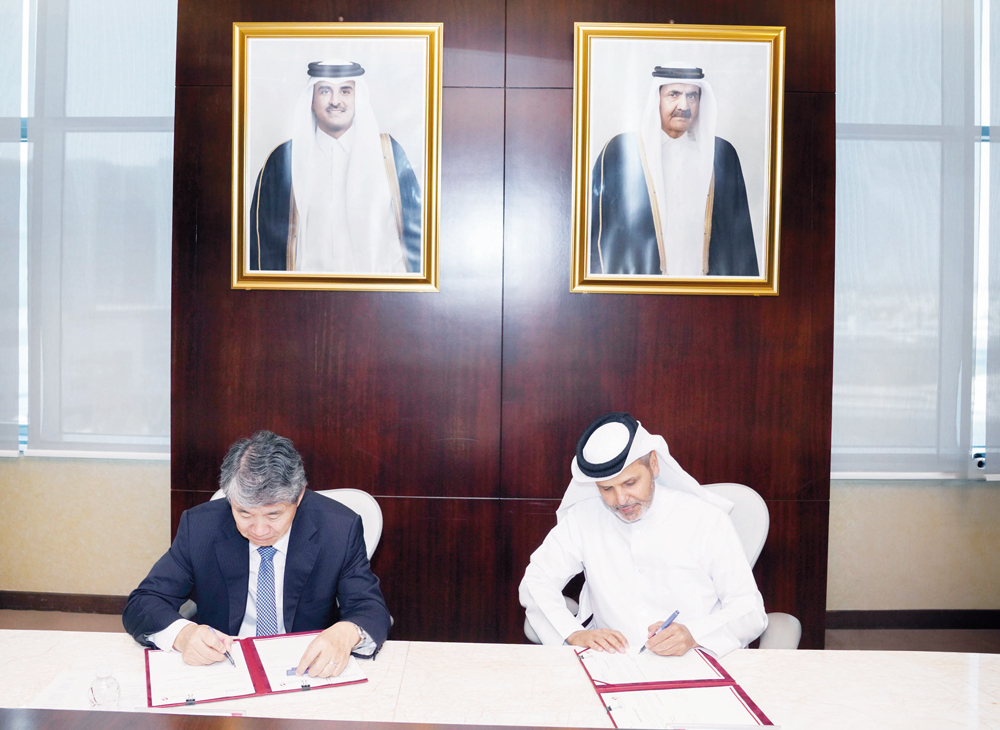 Dr. Saleh Ali Al Marri, Assistant Minister of Health Affairs at the Ministry of Public Health, and Hua Liu, Deputy Director General of the International Atomic Energy Agency, signing the agreement.
