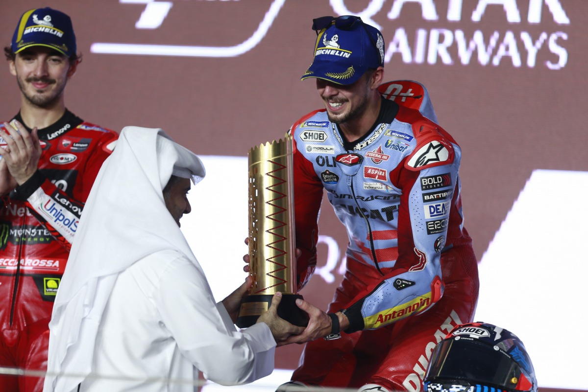 Qatar Airways Group Chief Executive Engr. Badr Mohammed Al Meer presents Gresini Racing’s Fabio Di Giannantonio with the winner's trophy for the MotoGP Qatar Airways Grand Prix of Qatar 2023. Pic: Rajan Vadakkemuriyil / The Peninsula 