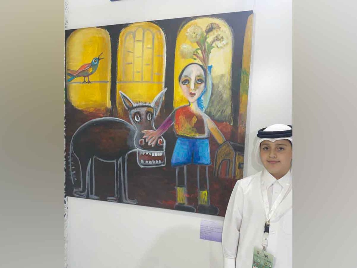 Khalid Fisal Ridah, the youngest artist at the festival with his painting “The Happy Donkey.”