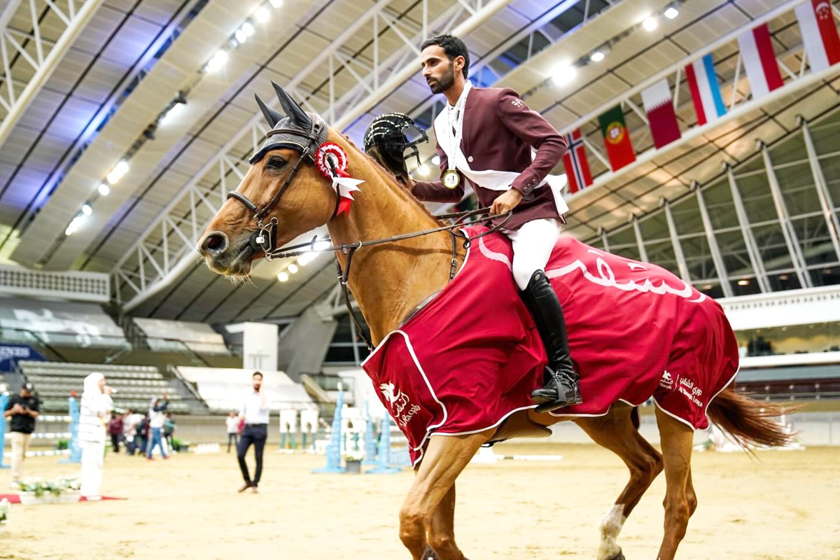 Rashid Towaim Al Marri celebrates astride Van Gallettana Z after winning the CSI1 Open class.  