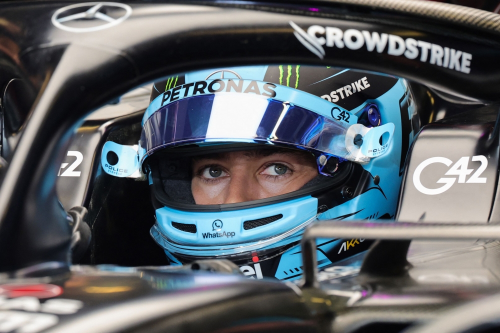 Mercedes' British driver George Russell sits in his car during the third practice session for the Abu Dhabi Formula One Grand Prix at the Yas Marina Circuit in the Emirati city on November 25, 2023. (Photo by Giuseppe Cacace / AFP)