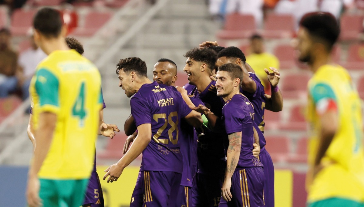 Al Arabi players celebrate after Youssef Msakni scored their first goal.