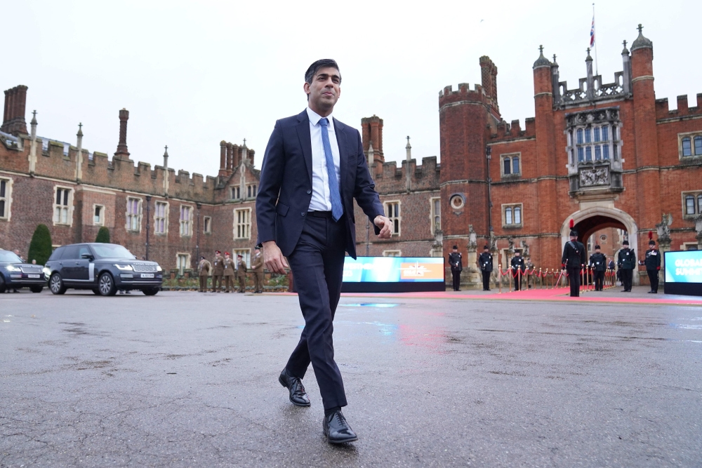 Britain's Prime Minister Rishi Sunak arrives at at Hampton Court Palace in south west London on November 27, 2023, to attend the Global Investment Summit. (Photo by Stefan Rousseau / POOL / AFP)