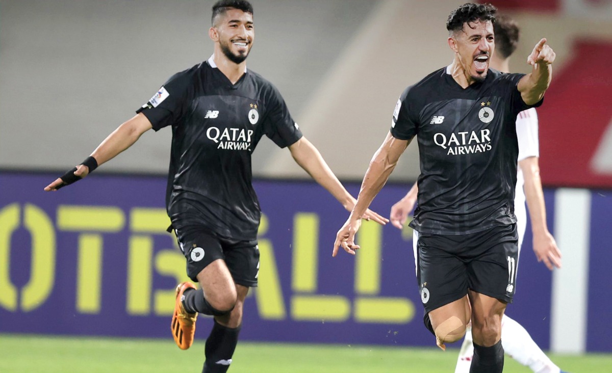 Al Sadd's Baghdad Bounedjah (right) celebrates with Mohammed Waad after scoring their second goal.