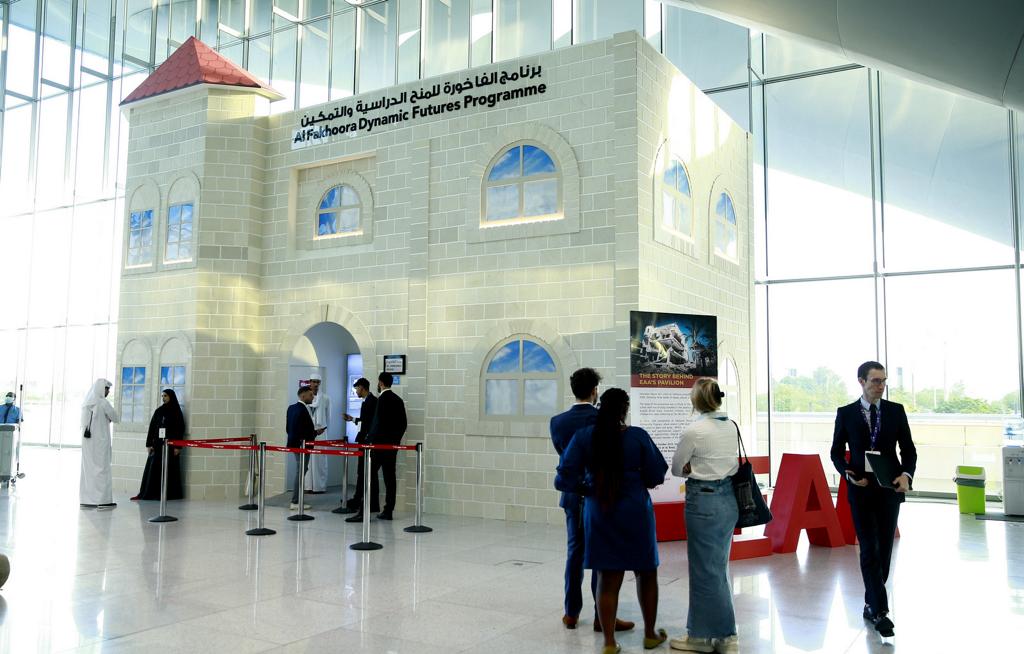 Participants visit EAA Foundation's Al Fakhoora House structure at WISE 11 yesterday.