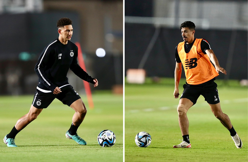 Al Sadd’s Mostafa Meshaal (left) and Baghdad Bounedjah take part in a training session. 