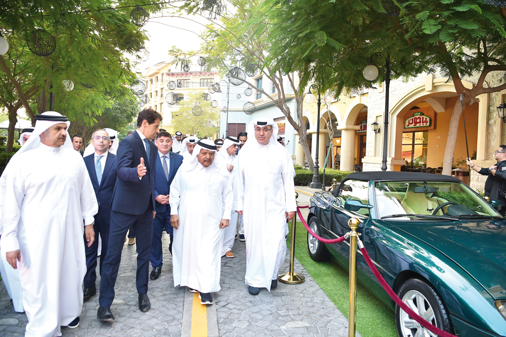 H E Sheikh Faisal bin Qassim Al Thani (second right); Omar Hussein Al Fardan (right), UDC President Ibrahim Jassim Al Othman (left), Ambassador of Egypt to Qatar, H E Amr Kamal El Din El Sherbiny (second left), Ambassador of Italy to Qatar, H E Paolo Toschi (third left), and Ambassador of Türkiye to Qatar, H E Dr. Mustafa Göksu (third right), along with other officials during the opening of the event at Medina Centrale yesterday.