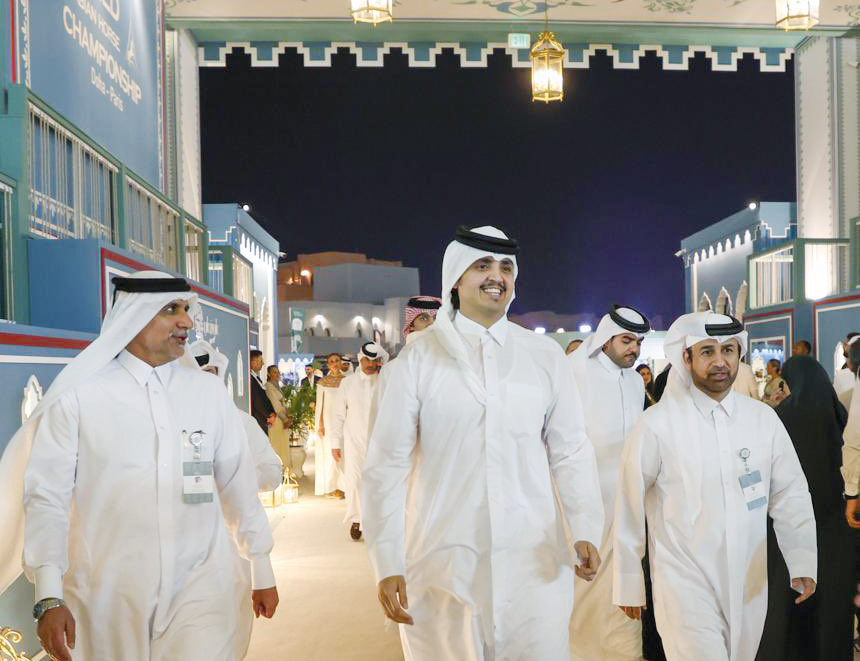 H E Sheikh Thani bin Hamad bin Khalifa Al Thani (centre) with General Manager of Cultural Village Foundation, Katara Prof. Dr. Khalid bin Ibrahim Al Sulaiti (right), and other officials during the opening of the World Arabian Horse Championship 2023 at the Old Doha Port yesterday.