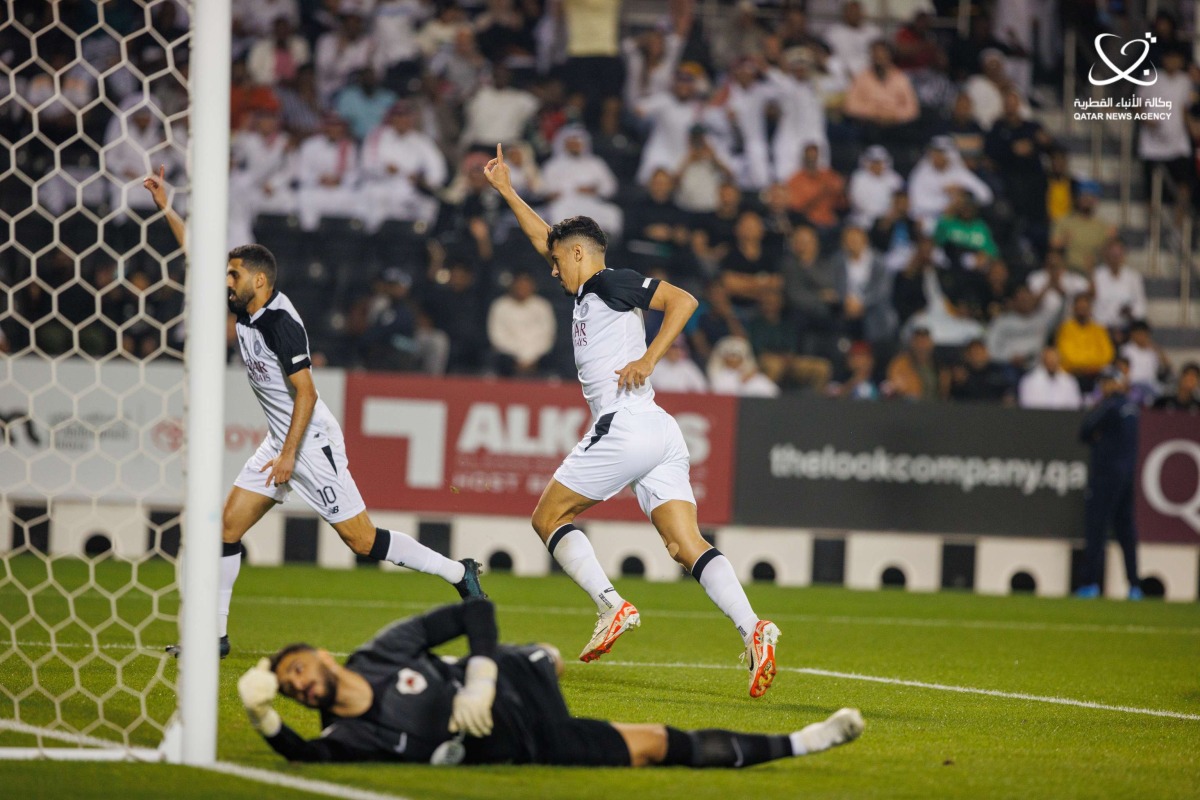 Al Sadd's Baghdad Bounedjah (right) celebrates after scoring a goal, yesterday.