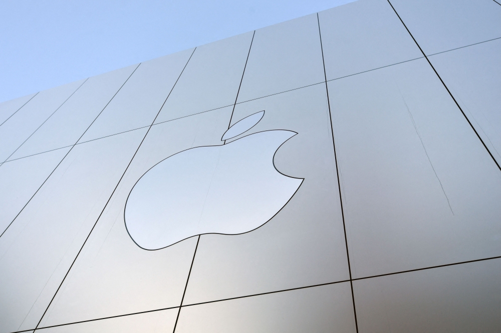 An Apple logo is seen on the outside of an Apple store as new iPhones are released for sale in San Francisco, California on September, 22, 2017. Photo by Josh Edelson / AFP