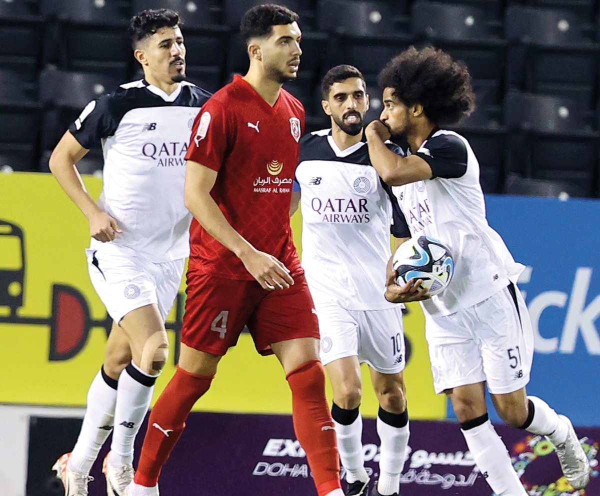 Al Sadd's Akram Afif (right) celebrates after scoring a goal yesterday. 