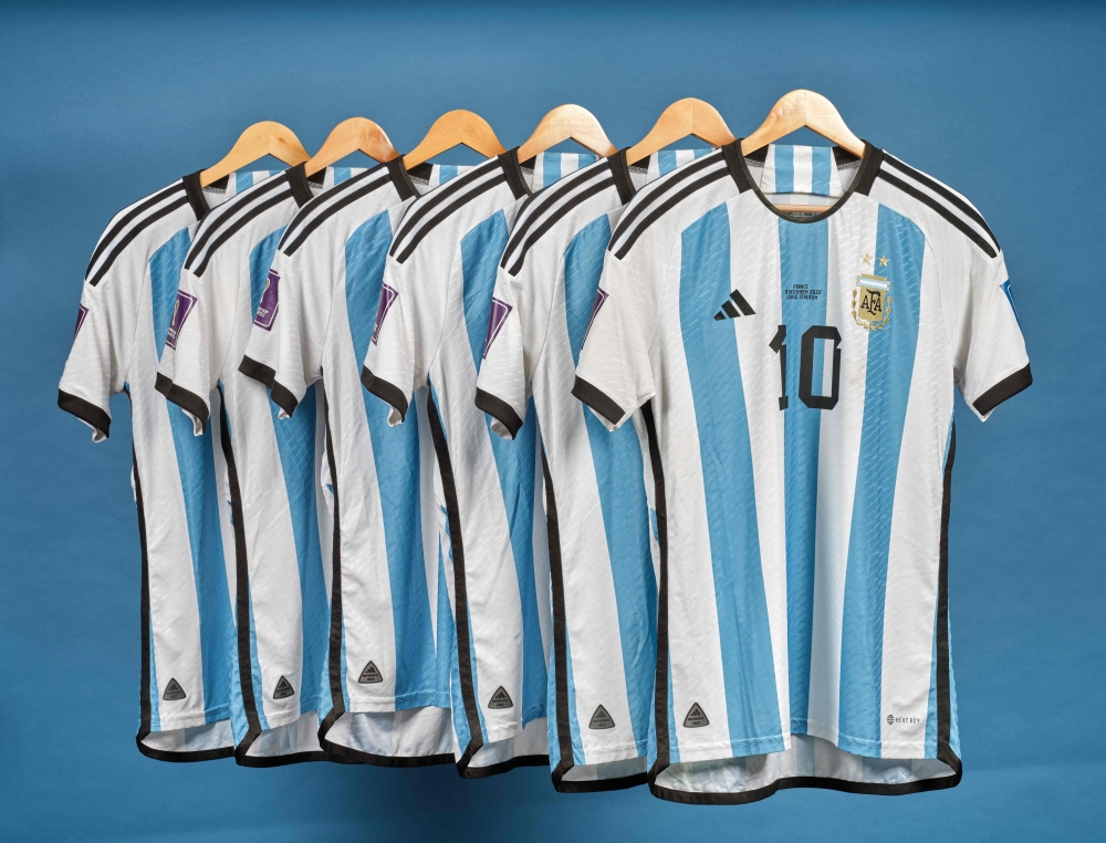 This undated photo courtesy of Sotheby's shows Lionel Messi's set of six match worn shirts from the 2022 FIFA World Cup. (Photo by SOTHEBY'S / AFP) 

