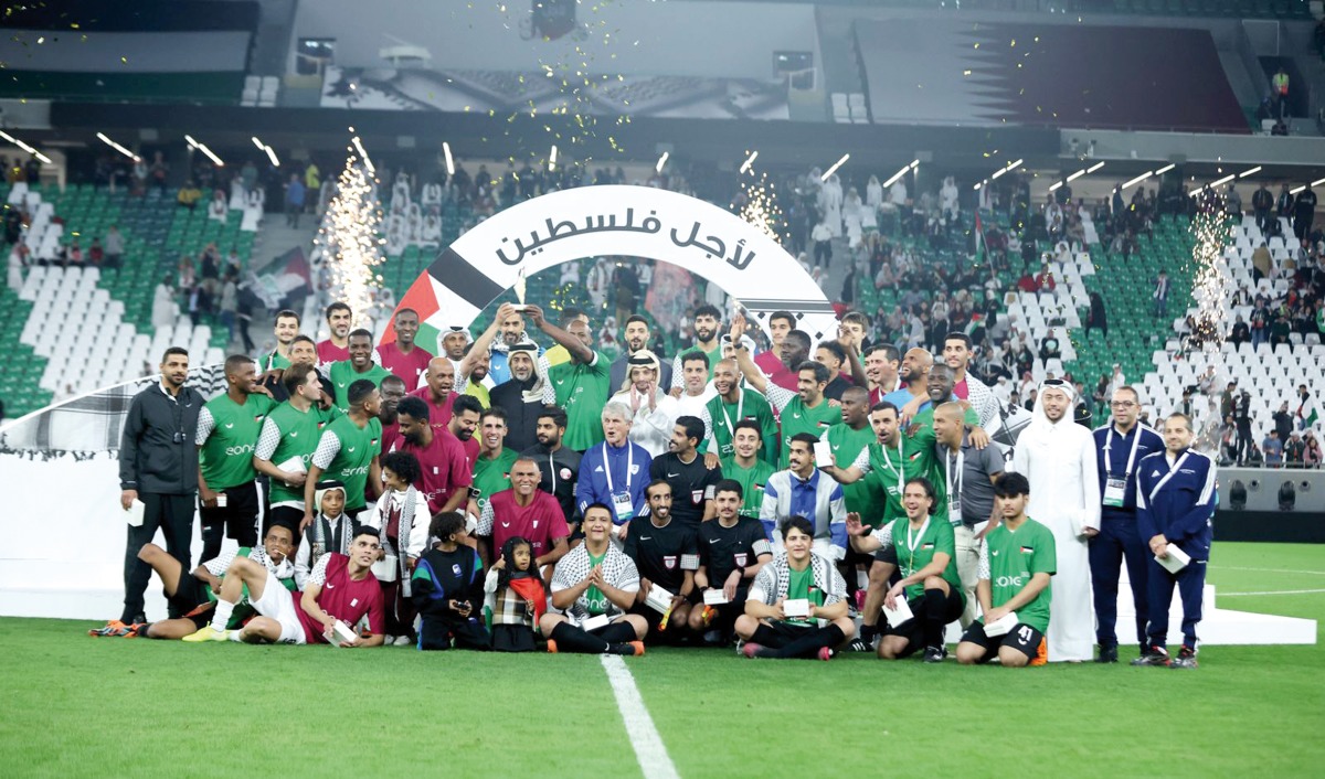 Minister of Sports and Youth H E Salah bin Ghanim Al Ali and other officials with players at the conclusion of the fundraising match at Education City Stadium yesterday. 