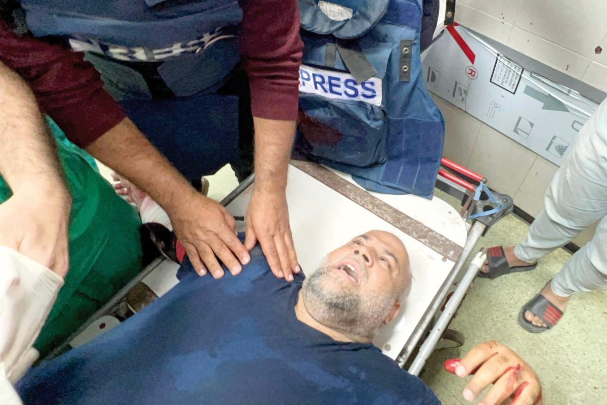 Veteran Al Jazeera correspondent Wael Al Dahdouh receives medical care after he was injured in an Israeli strike while reporting, at Nasser Hospital in Khan Yunis in the southern Gaza Strip, yesterday. (AFP)