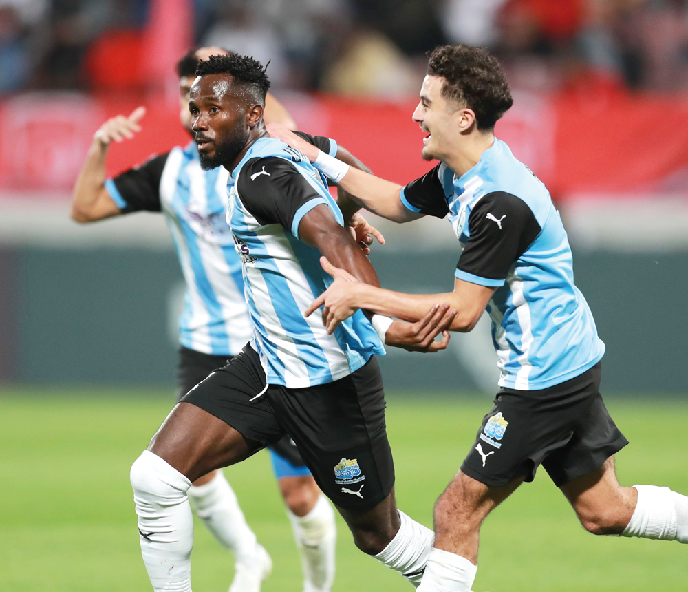 Omar Ali (centre) celebrates after scoring Al Wakrah's second goal against Al Duhail. 