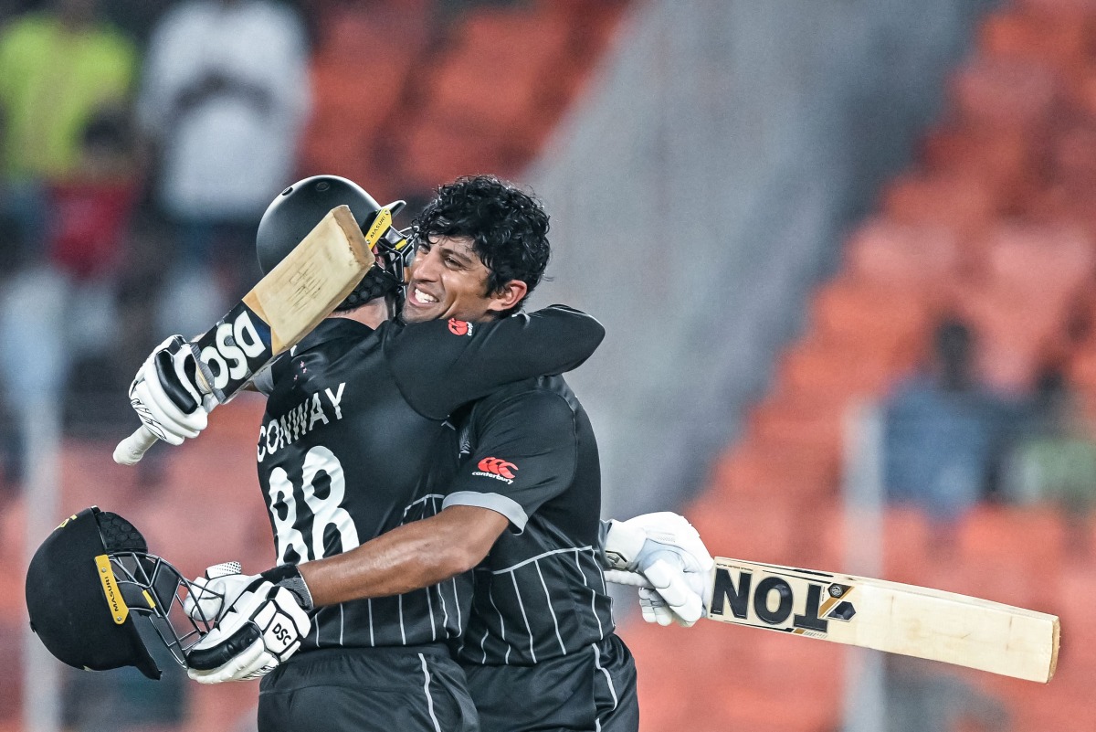 New Zealand’s Rachin Ravindra (right) celebrates with Devon Conway after scoring a century during the 2023 ICC men’s cricket World Cup match against England in Ahmedabad in this October 5, 2023 file photo. 