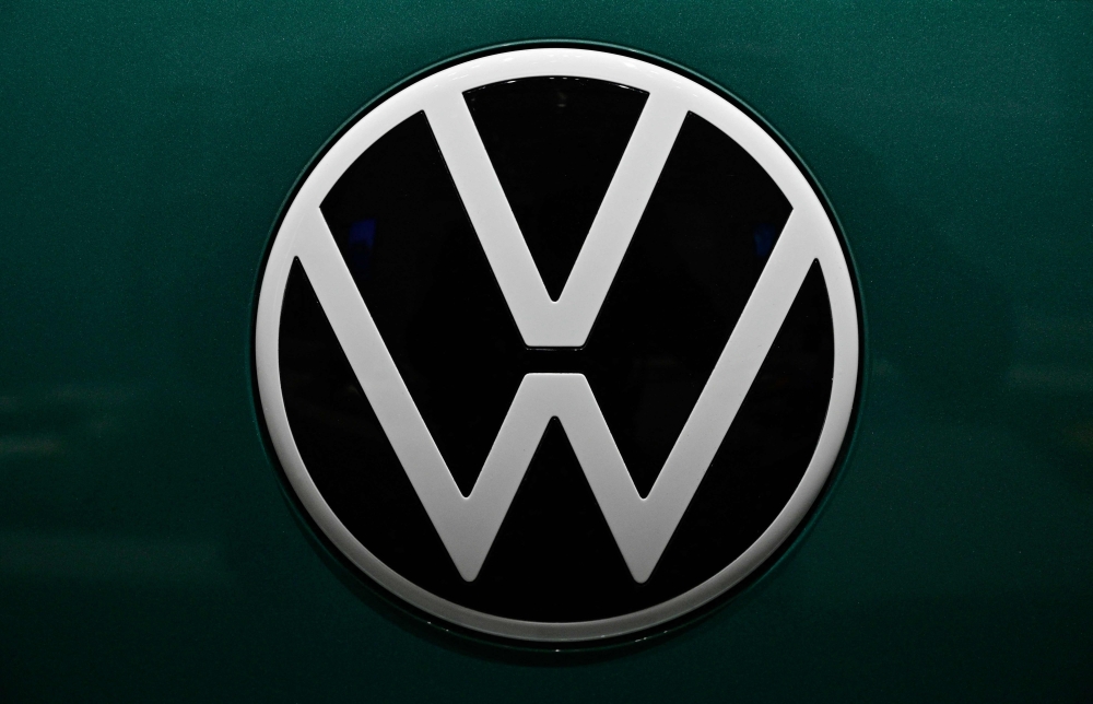 The logo of German car giant Volkswagen (VW) is pictured on a Volkswagen ID Buzz van during the company's annual press conference to present the business report, on March 14, 2023 in Berlin. Photo by John MACDOUGALL / AFP

