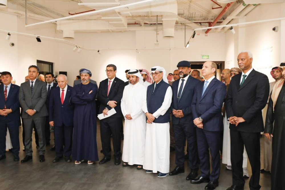 Minister of State and President of Qatar National Library H E Dr. Hamad Bin Abdulaziz Al Kawari (fourth right), Katara General Manager Prof. Dr. Khalid bin Ibrahim Al Sulaiti (fifth right), Ambassador of Türkiye to Qatar H E Dr. Mustafa Goksu (left) and Ambassador of Sudan to Qatar H E Ahmed Abdel Rahman Mohamed Hassan Siwar Al Dahab (right) along with other dignitaries, officials and artists during the “Bond” exhibition opening at Katara yesterday. 