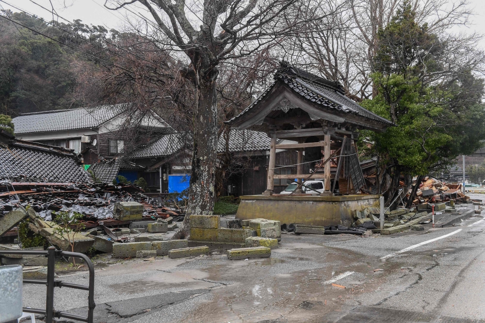 This picture shows damaged buildings in the town of Misaki in Suzu city, Ishikawa prefecture on January 7, 2024. (Photo by Toshifumi Kitamura / AFP)