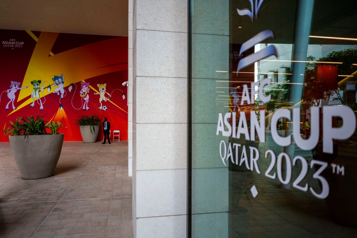 A sentinel guards an entrance of the Main Media Center (MMC) of the Asian Cup 2023 football tournament in Doha on January 9, 2024. (Photo by Jewel SAMAD / AFP)