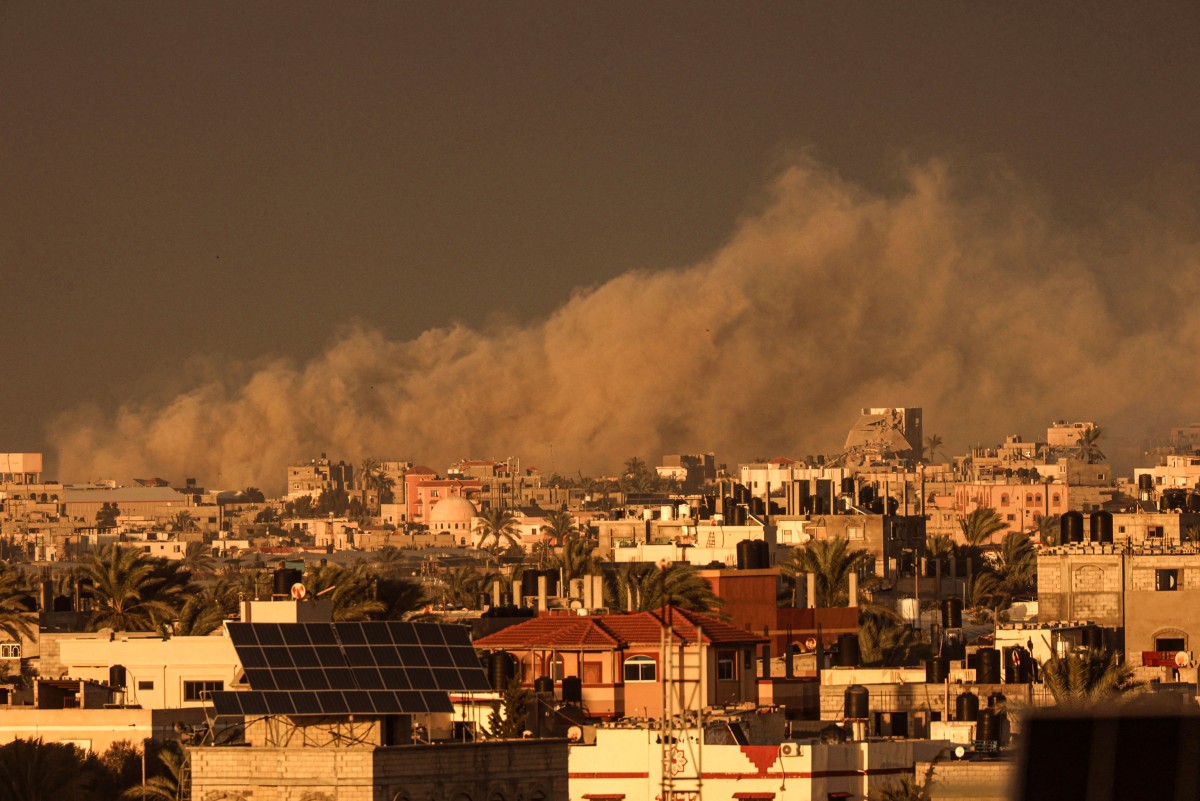 A picture taken from Rafah shows smoke billowing over Khan Yunis in the southern Gaza Strip during Israeli bombardment on January 11, 2024. 