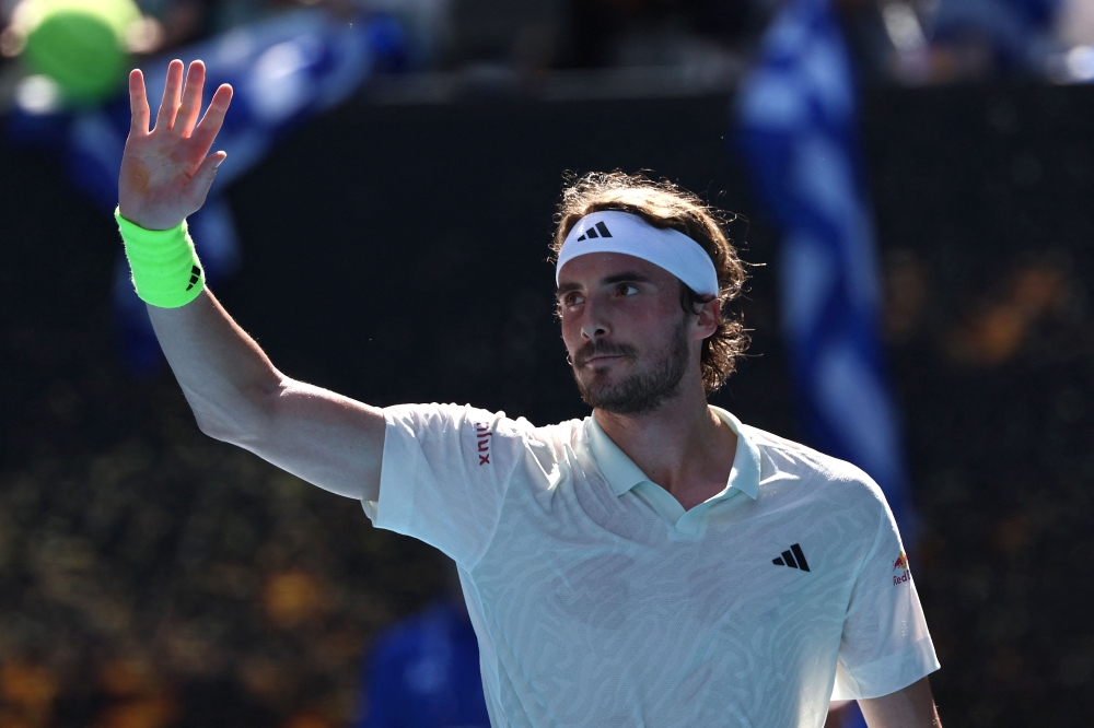 Greece's Stefanos Tsitsipas celebrates winning against Belgium's Zizou Bergs after their men's singles match on day two of the Australian Open tennis tournament in Melbourne on January 15, 2024. (Photo by David GRAY / AFP)