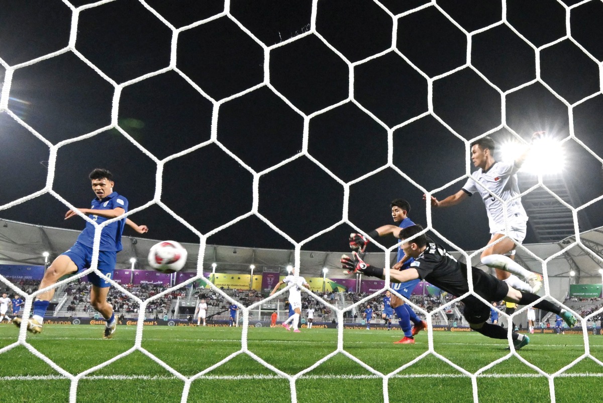 Thailand’s Supachai Chaided shoots to score his team’s first goal against Kyrgyzstan. AFP