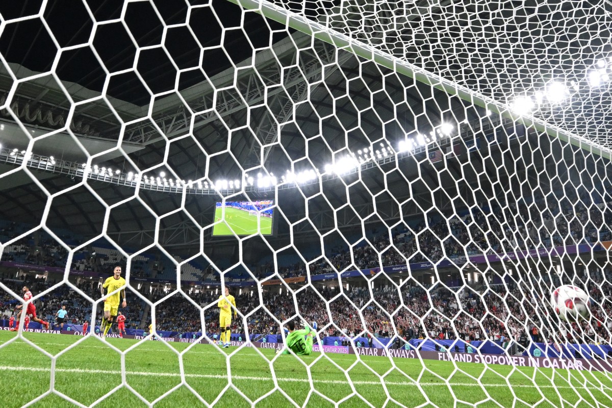 Jordan's midfielder #10 Musa al-Tamari celebrates after scoring his team's fourth goal during the Qatar 2023 AFC Asian Cup football match against Malaysia on January 15, 2024. (Photo by Hector Retamal / AFP)