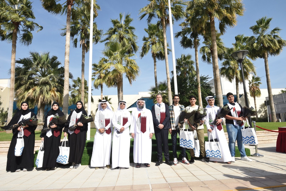 UDST President Dr. Salem Al Naemi with officials and students during the event.