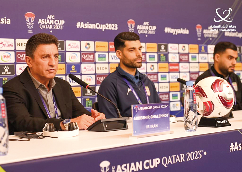 Iran coach Amir Ghalenoei (left) speaks during a press conference, yesterday.