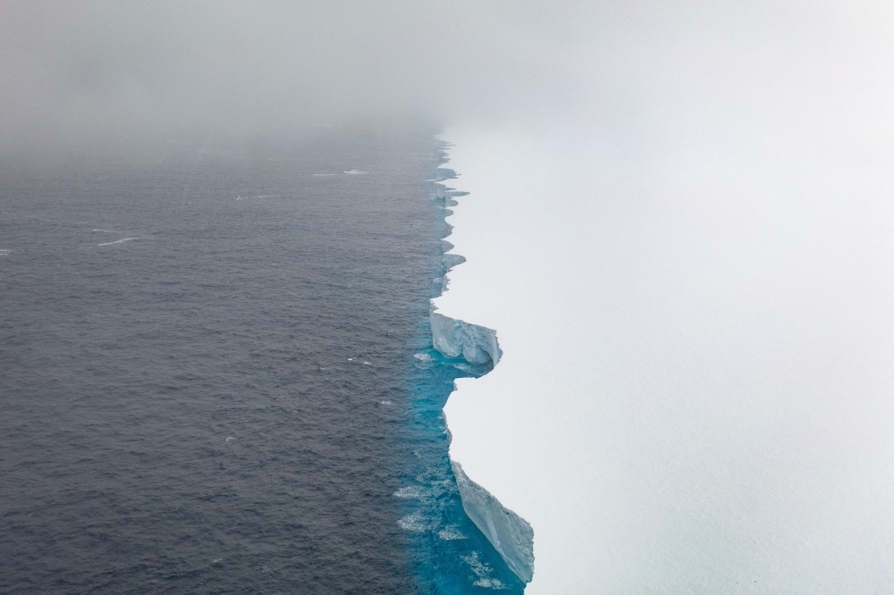 This handout image released by EYOS Expeditions on January 19, 2024, shows an aerial view of the A23a iceberg in the waters of The Southern Ocean off Antarctica on January 14. (Photo by Ian Strachan / EYOS Expeditions / AFP) 