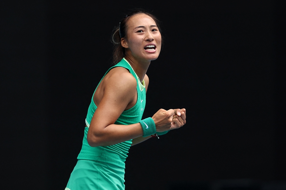 China's Zheng Qinwen celebrates victory against her compatriot Wang Yafan during their women's singles match on day seven of the Australian Open tennis tournament in Melbourne on January 20, 2024. (Photo by Martin Keep / AFP) 