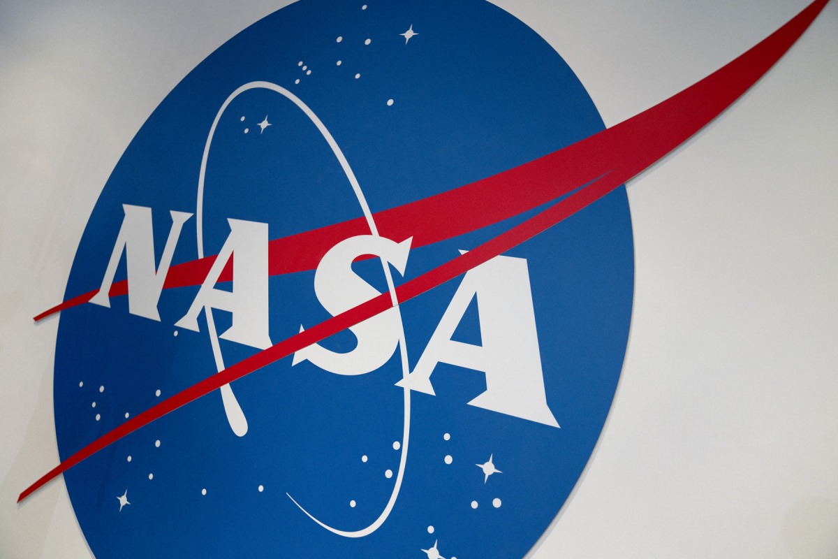 The NASA logo is displayed at the Earth Information Center exhibit, at NASA headquarters in Washington, DC, on June 21, 2023. Photo by Stefani REYNOLDS / AFP