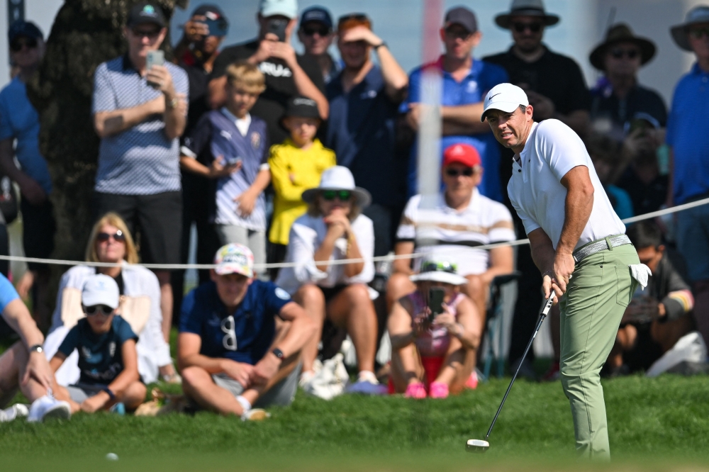 Rory McIlroy of Northern Ireland plays his third shot on the 1st hole during the final round of Hero Dubai Desert Classic on the Majlis Course at the Emirates Golf Club in Dubai on January 21, 2024. (Photo by Ryan LIM / AFP)