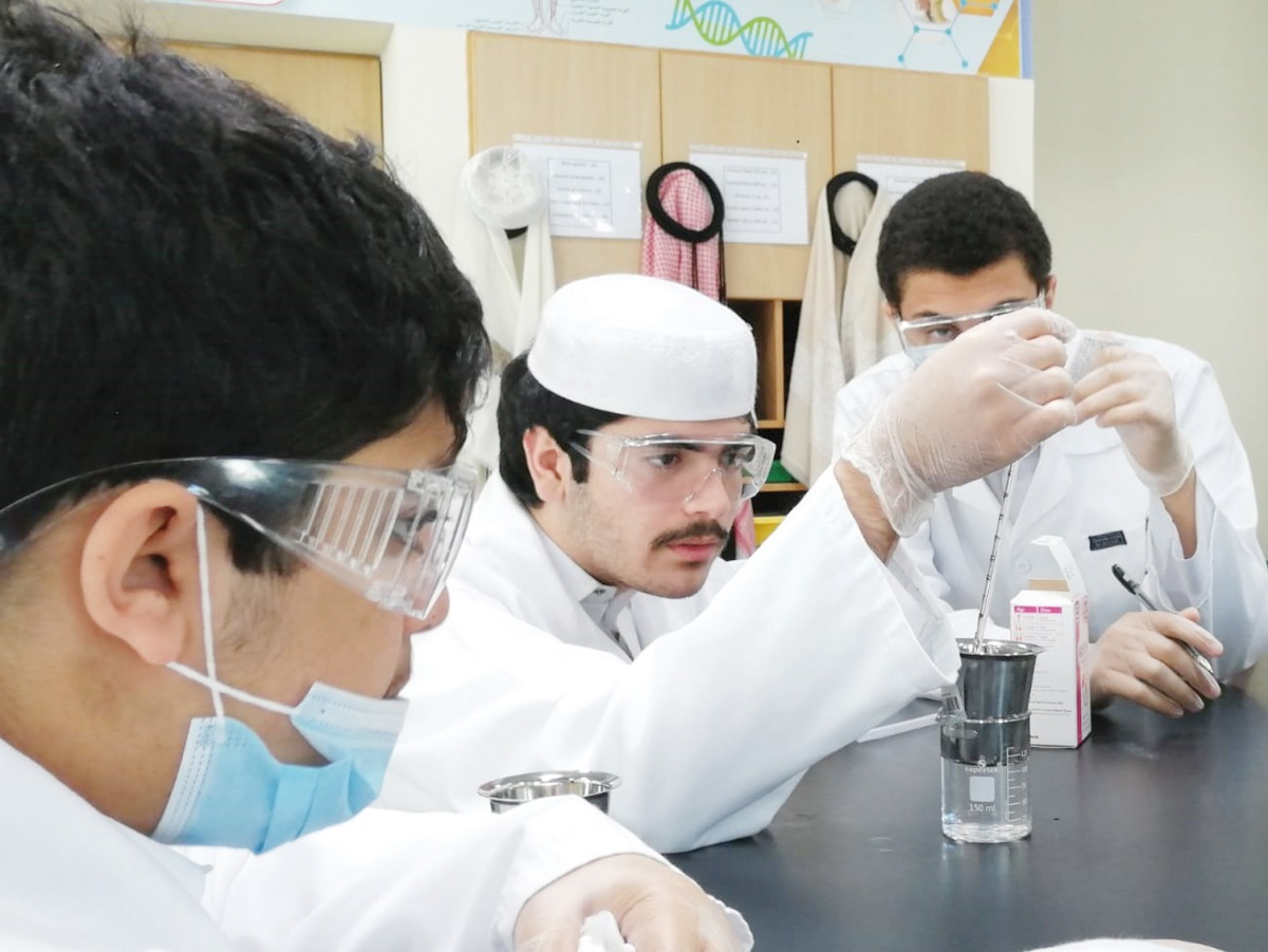 Young scientists at work in a laboratory.