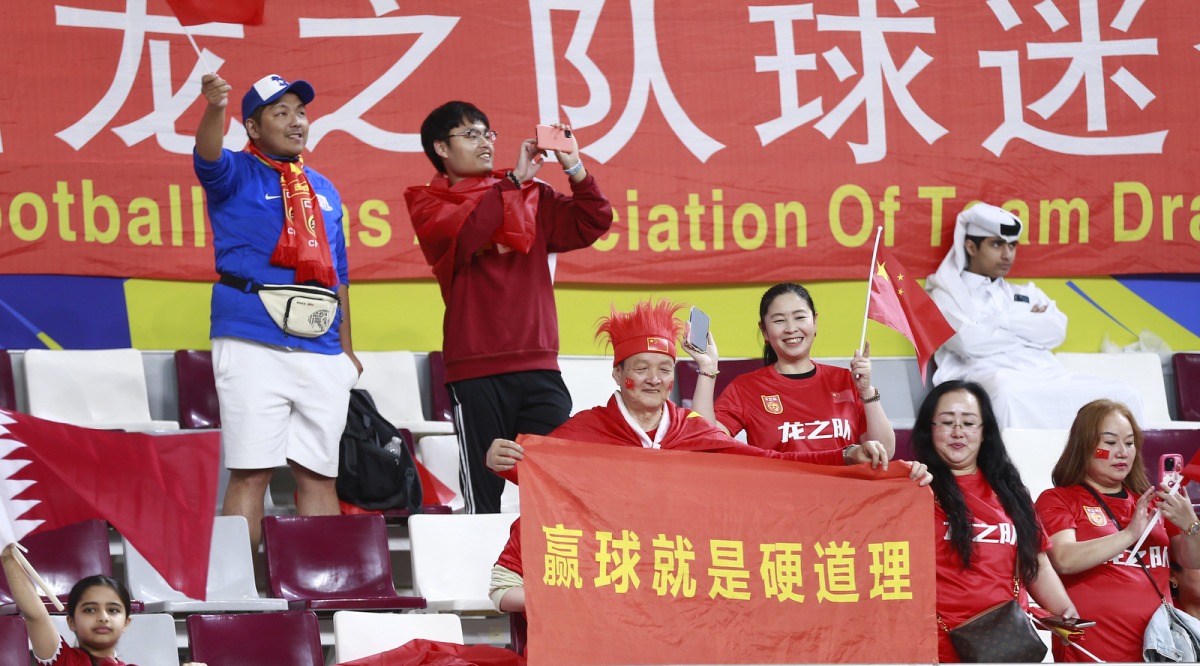 Image of China football team fans ahead of their match at Khalifa International Stadium. Pic by Rajan Vadakkemuriyil / The Peninsula 