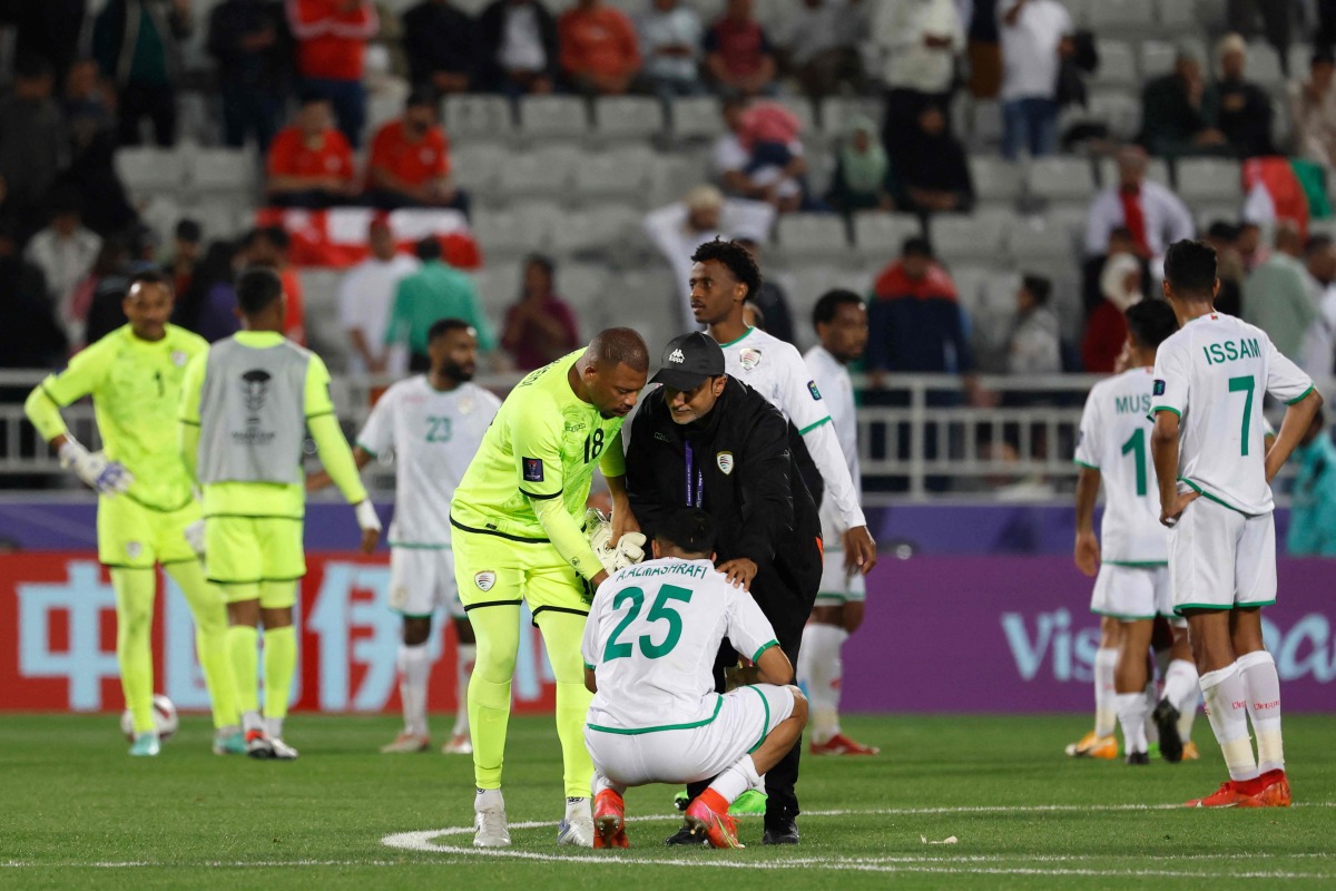 Oman’s players look dejected after the Group F match against Kyrgyzstan ended in a draw, yesterday. AFP