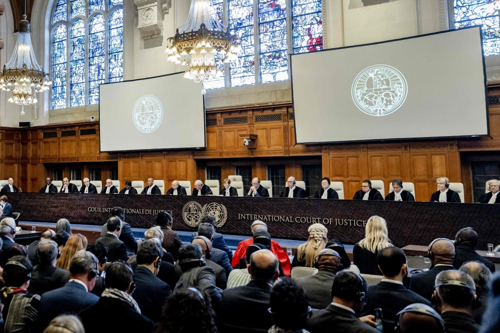 ICJ President Joan Donoghue (centre) speaks at the International Court of Justice (ICJ) prior to the verdict announcement in the genocide case against Israel, brought by South Africa, in The Hague on January 26, 2024. (Photo by Remko de Waal / ANP / AFP) 