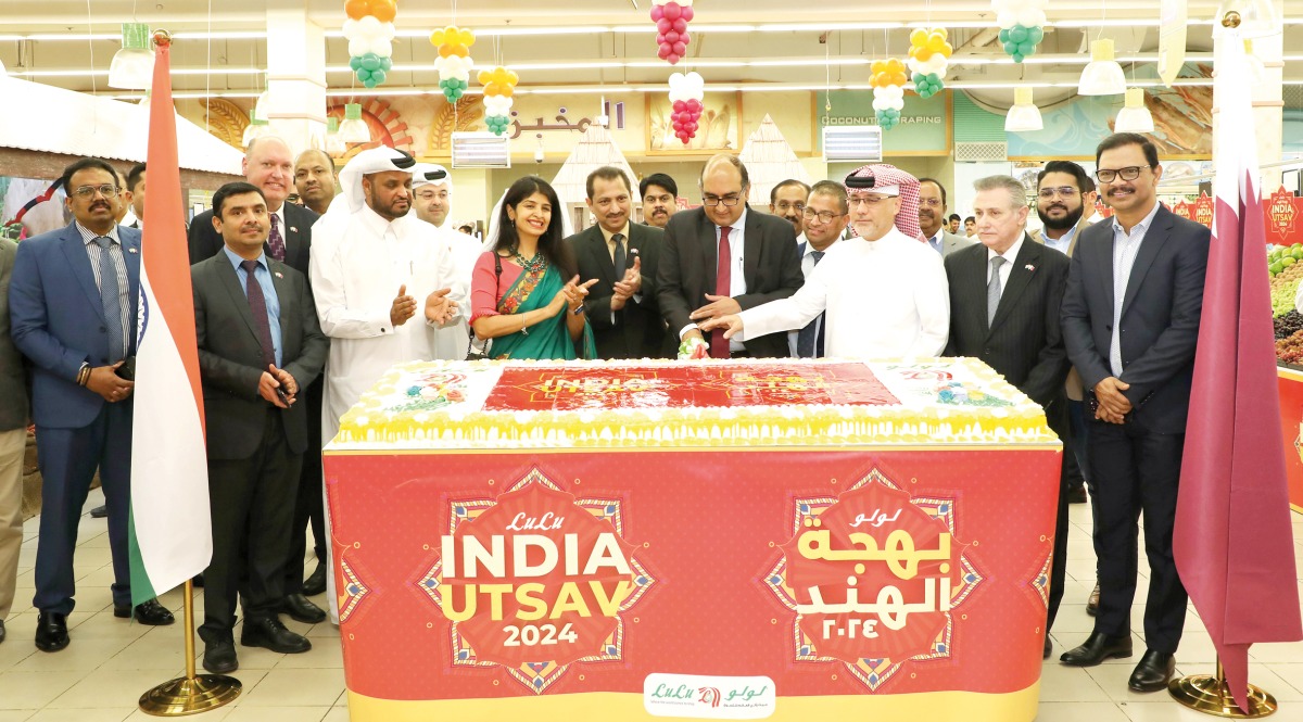 Ambassador of India to Qatar H E Vipul (fourth right) with other officials and guests cutting a cake to mark the opening of ‘India Utsav’ at Lulu Hypermarket, Al Gharafa.