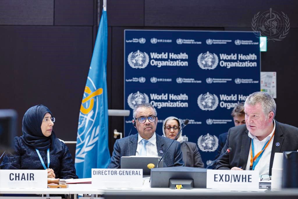 Minister of Public Health H E Dr. Hanan Mohammed Al Kuwari (left), WHO Director-General Dr. Tedros Adhanom Ghebreyesus (centre) and others attending the WHO Executive Board session. 