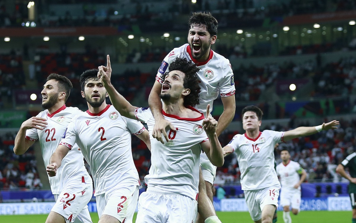 Tajikistan players celebrate.