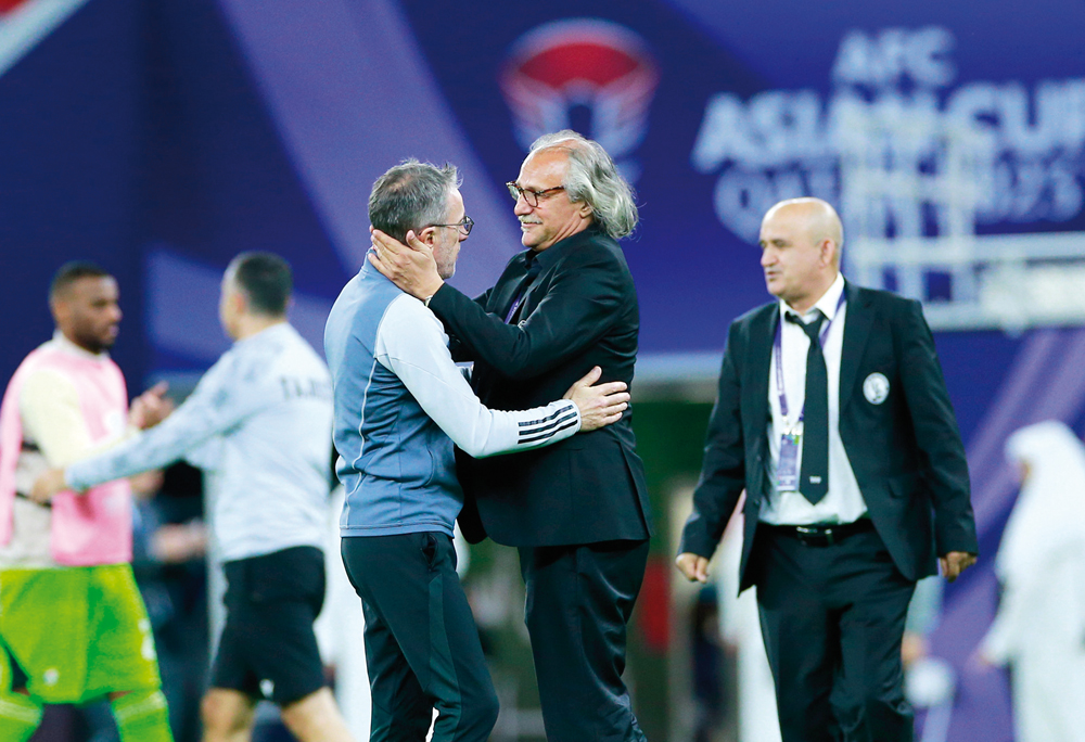 Tajikistan coach Petar Segrt (right) and UAE coach Paulo Bento after the match.