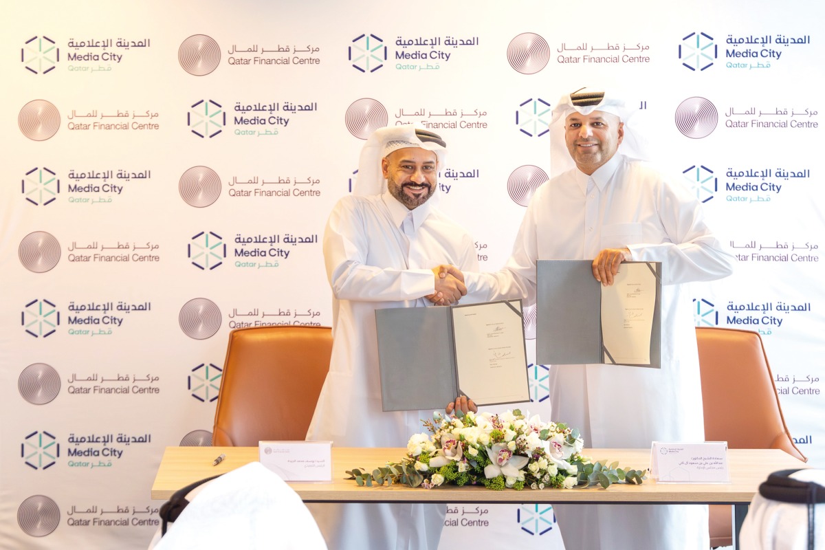 Media City Qatar Chairman H E Sheikh Dr. Abdulla bin Ali Al Thani and Chief Executive Officer of QFC Yousuf Mohamed Al Jaida (left) at the MoU signing.