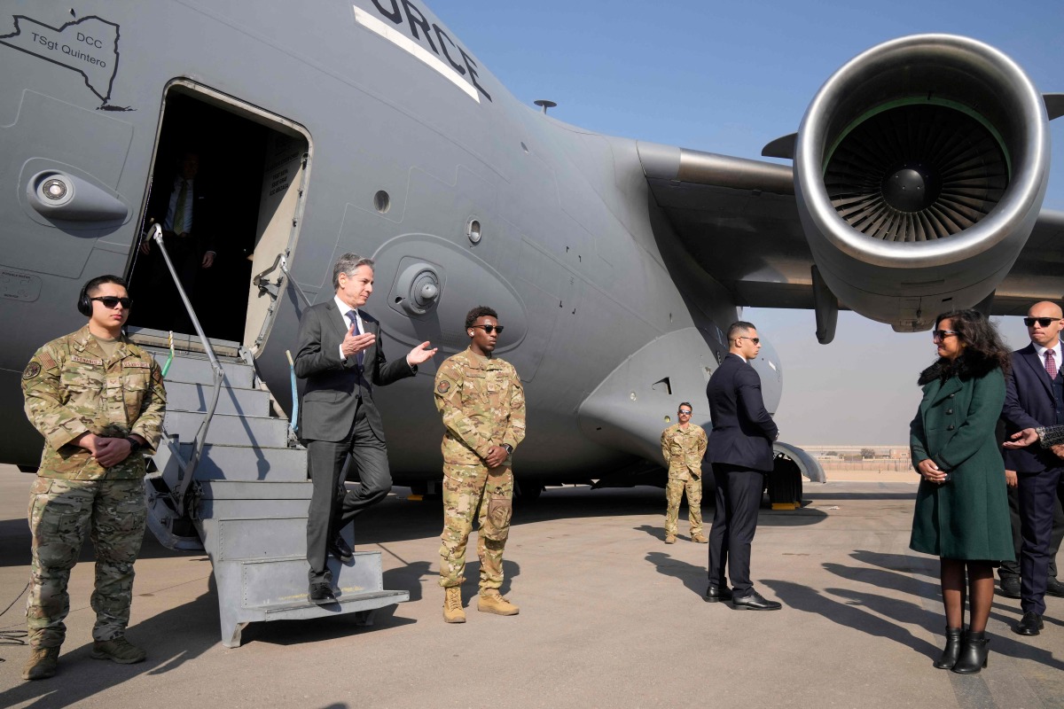 US Secretary of State Antony Blinken is welcomed by the Second Secretary for Egypt's Ministry of Foreign Affairs protocol Sarah Henry (R) upon arrival at Cairo East Airport in Cairo on February 6, 2024. (Photo by Mark Schiefelbein / POOL / AFP)
