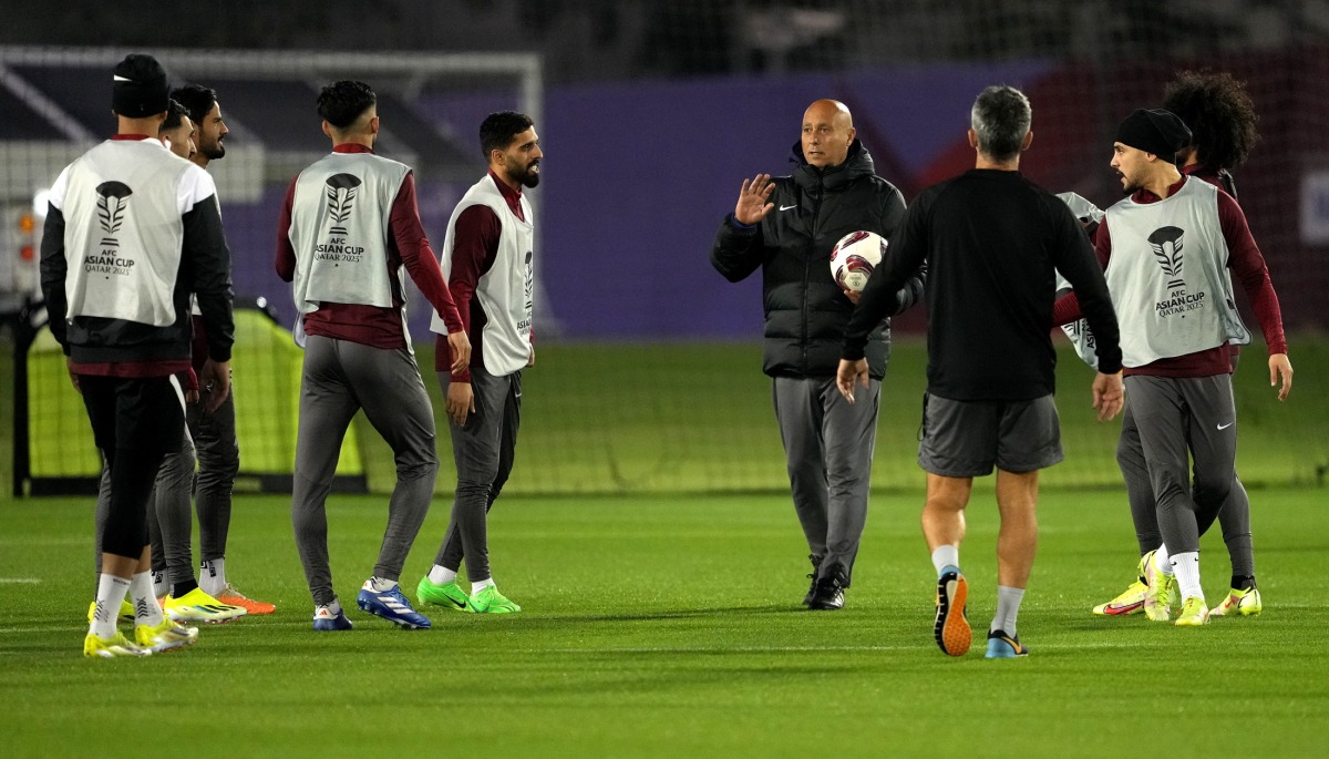 Qatar coach Marquez Lopez speaks to his players during a training session ahead of the semi-final against Iran. Photo by: Mohammed Faraj/The Peninsula 