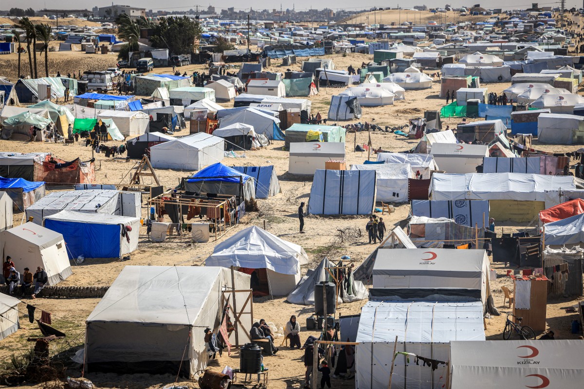 Picture taken on January 30, 2024, shows view of tents in a make-shift shelter for Palestinians who fled to Rafah in the southern Gaza Strip. (Photo by Mahmud Hams / AFP)