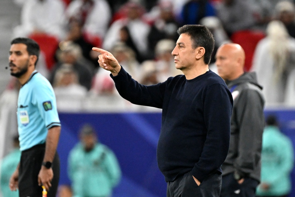 Iran coach Amir Ghalenoei gives instructions during the semi-final. 