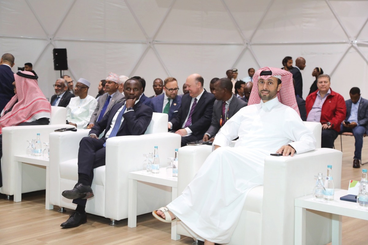 Minister of Municipality H E Abdullah bin Hamad bin Abdullah Al Attiyah (right), Rwanda's Minister of Agriculture H E Ildephonse Musafiri (second right) and others at the event. 