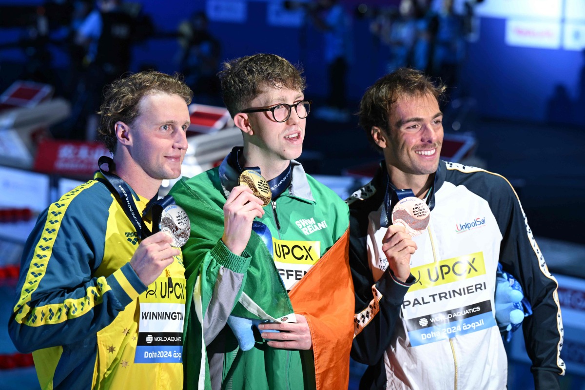 FROM LEFT: Australia’s silver-medallist Elijah Winnington, Ireland’s gold-medallist Daniel Wiffen and Italy’s bronze-medallist Gregorio Paltrinieri pose for a picture on the podium of the men’s 800m freestyle swimming event yesterday. PIC: AFP